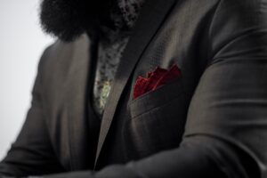Man with red pocket square in suit jacket