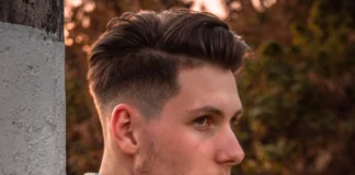 Man with low taper fade haircut.