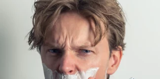 A man shaving with a bad razor